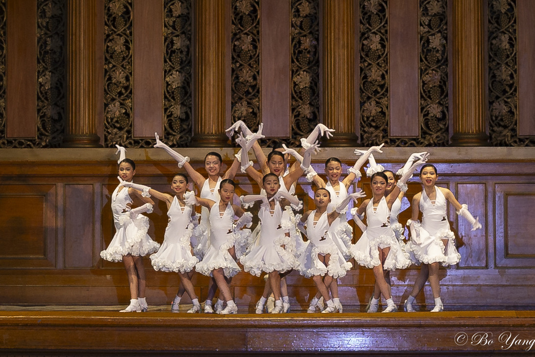 Youth Latin team performing on stage